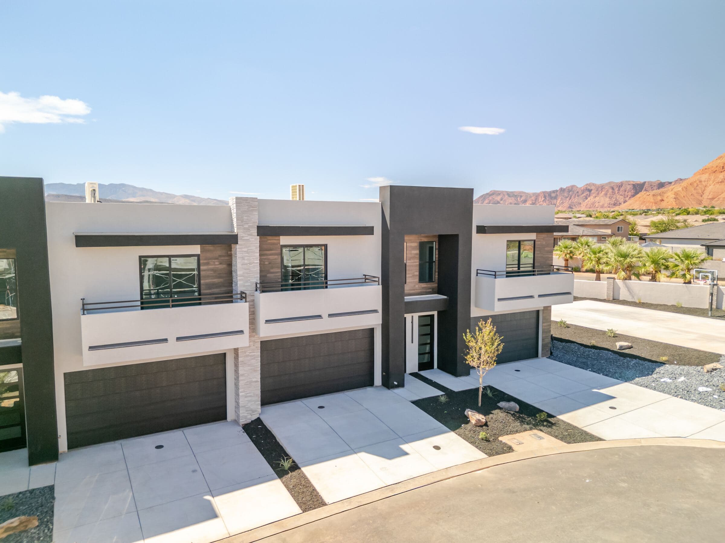 Solace Townhomes front elevation with red rock and Pine Valley Mountain views in Santa Clara, Utah