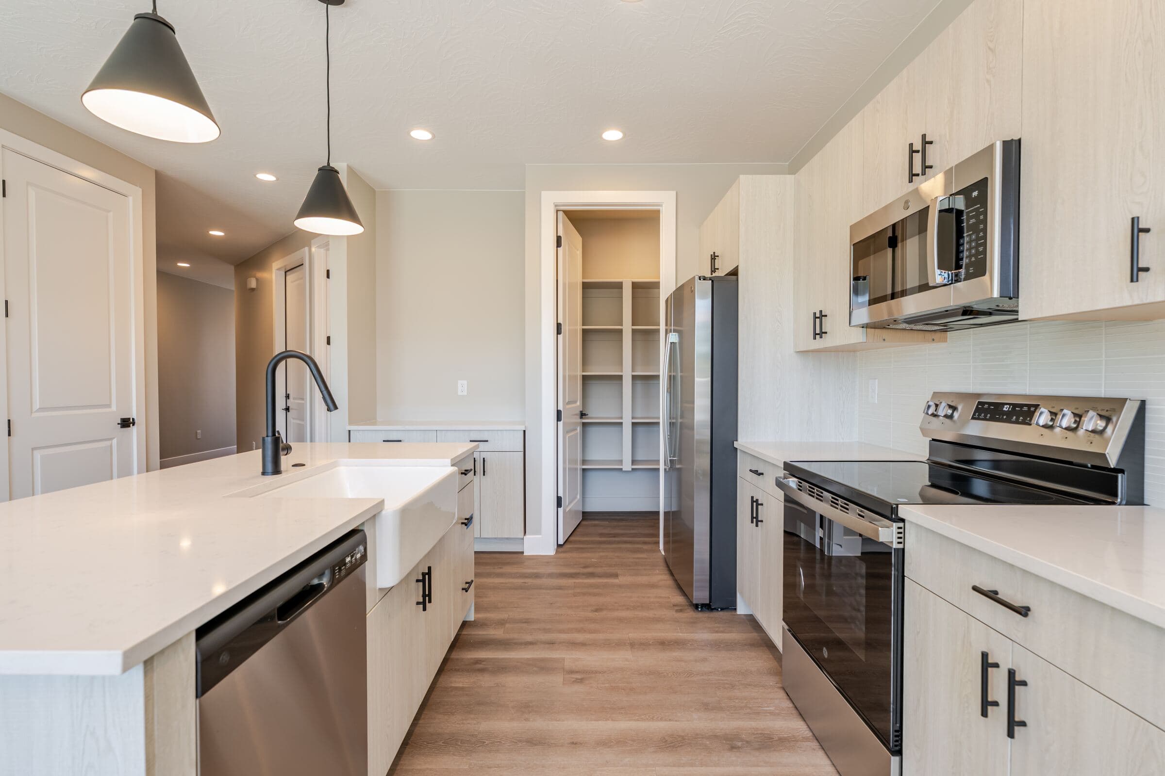 Kitchen with walk-in pantry and stainless steel range